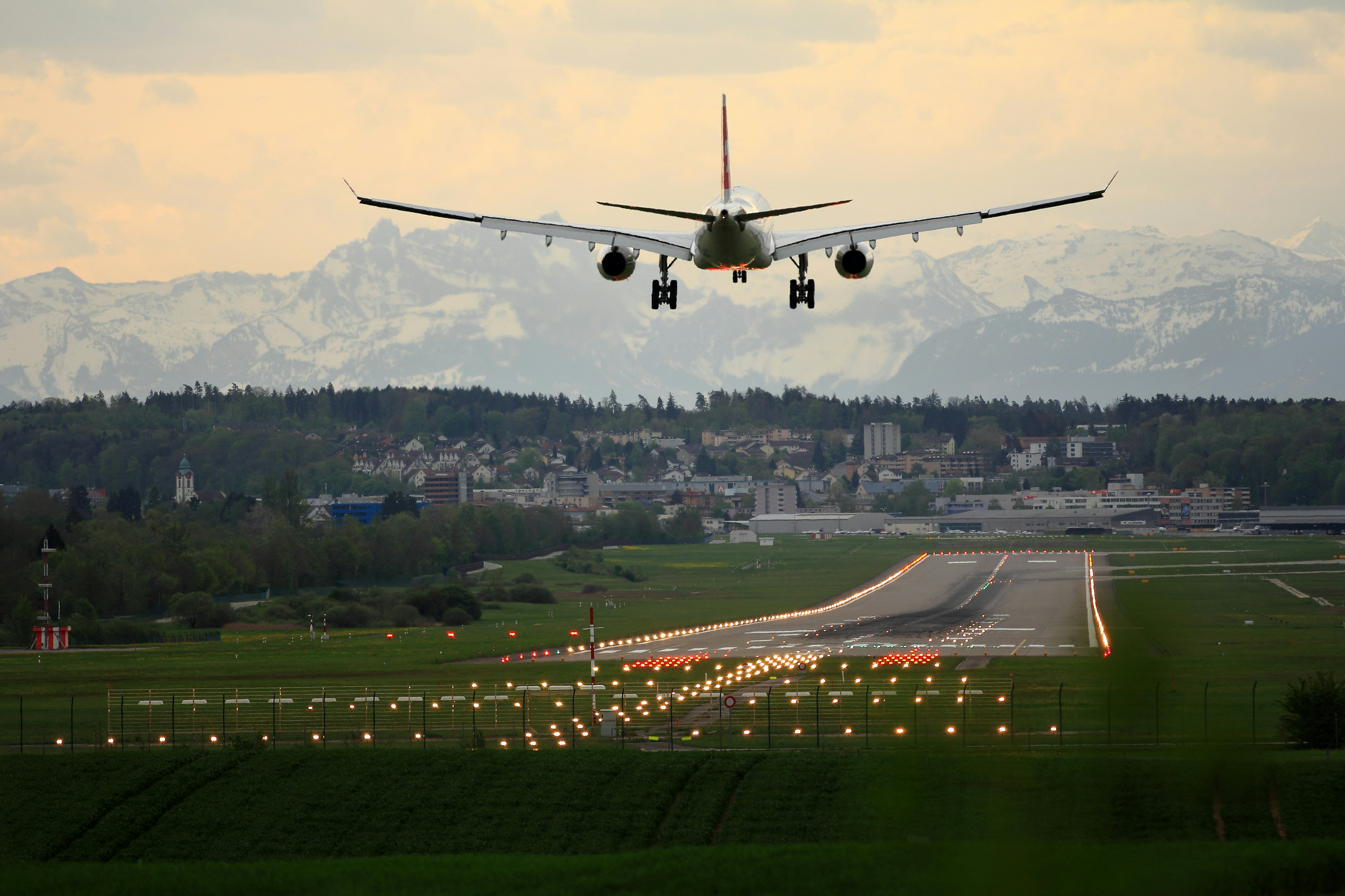 Wide-body aircraft taking off at dawn