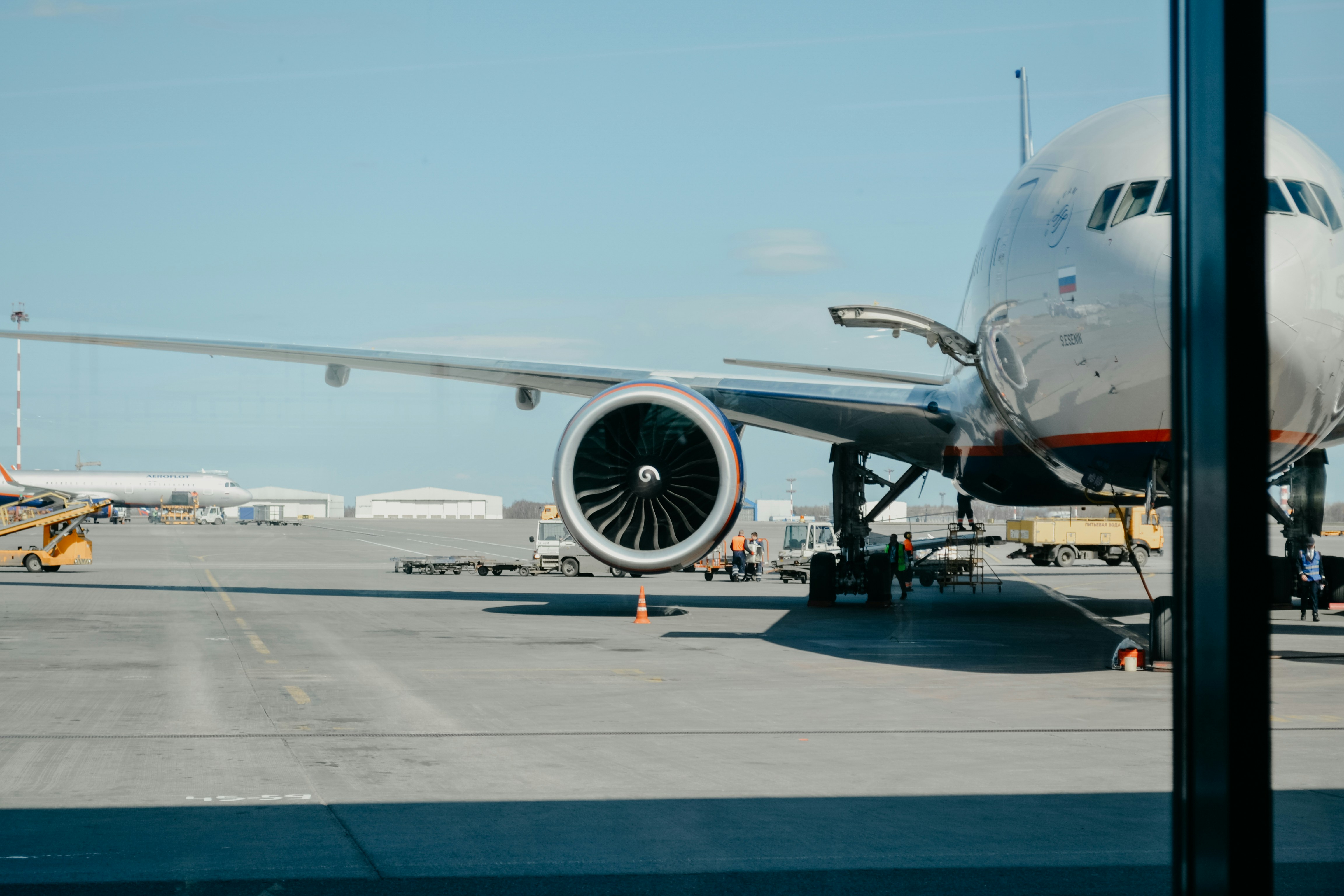 Aerial view of airport ramp with multiple commercial airliners