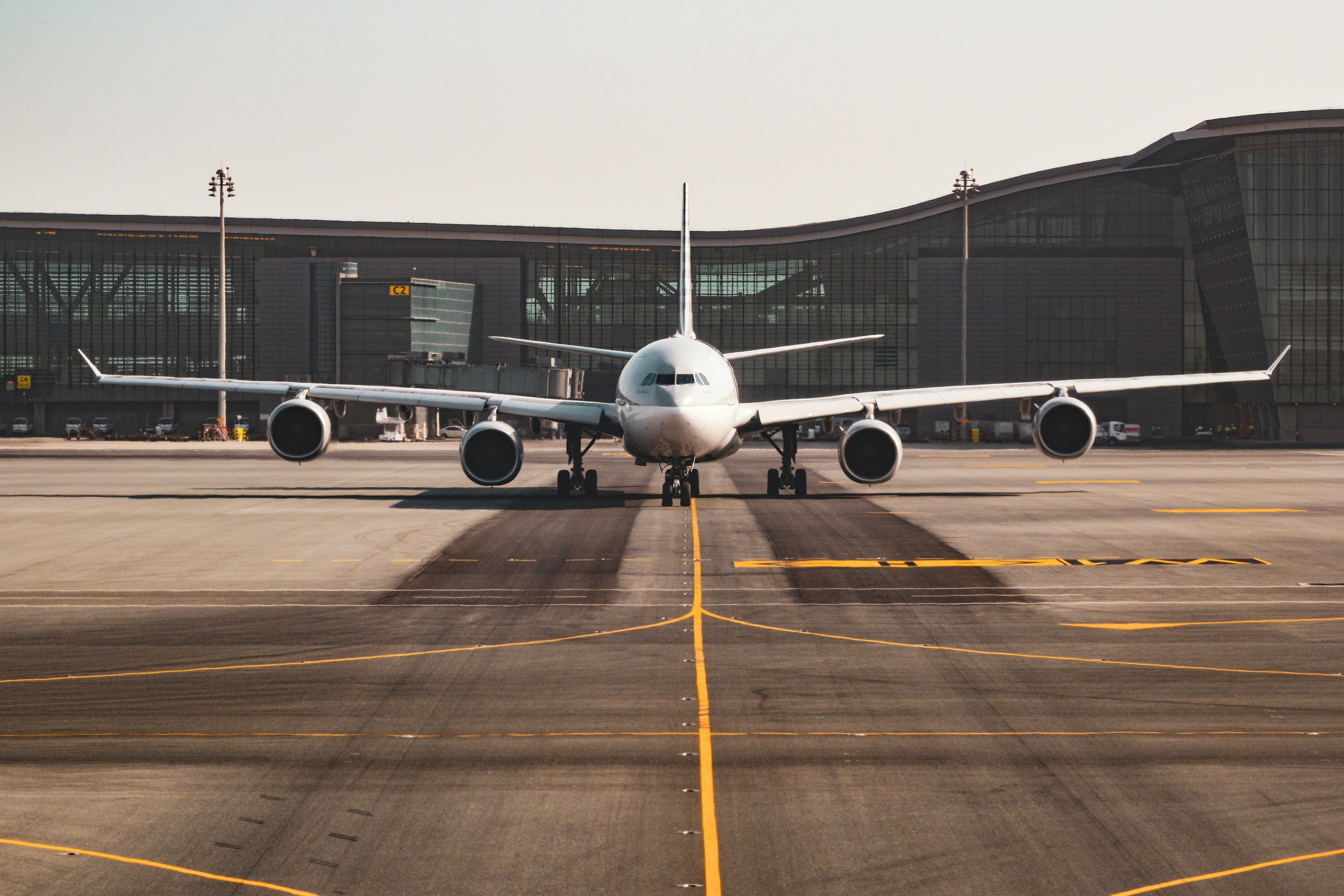 Aviation MRO hangar with aircraft being serviced by engineers